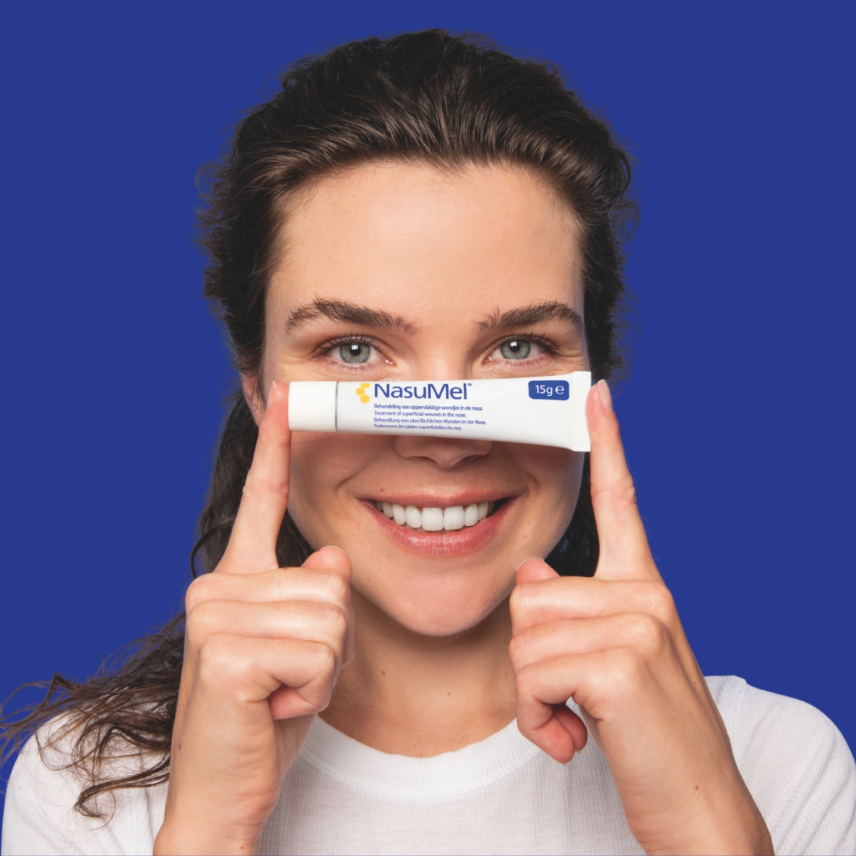 Women holding NasuMel nasal ointment